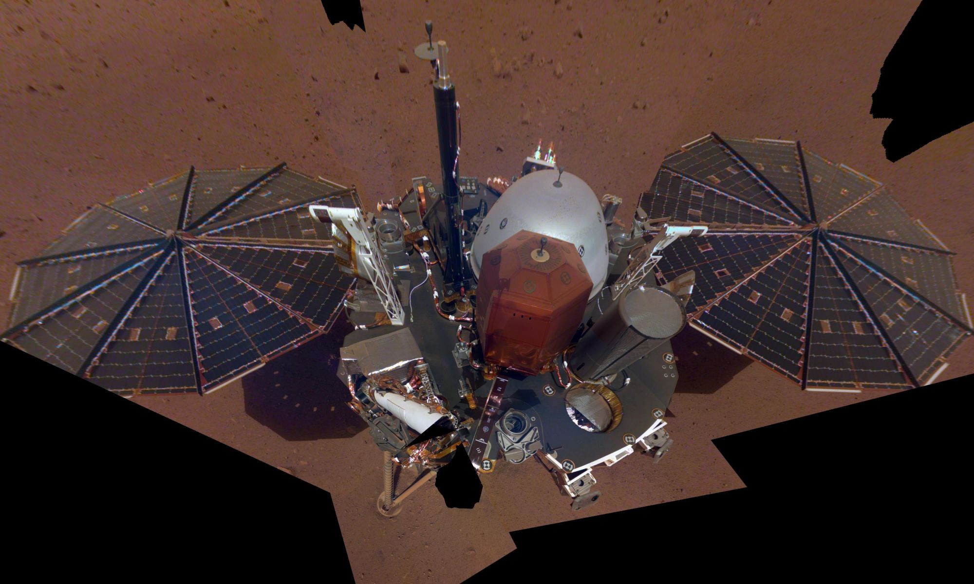 InSight's first full selfie on Mars. The selfie was taken on Dec. 6th, and is a mosaic of 11 images taken with its Instrument Deployment Camera on the elbow of its robotic arm. Image Credit: NASA/JPL-Caltech
