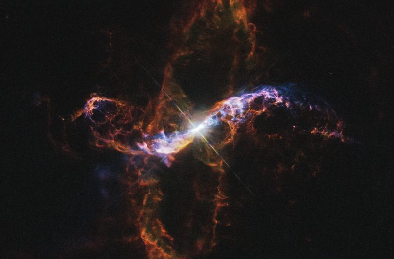 R Aquarii is called a symbiotic star system because of their relationship. As the white dwarf draws in material from the Red Giant, it ejects some if it in weird looping patterns, seen in this Hubble image. Image Credit: By Judy Schmidt from USA - Symbiotic System R Aquarii, CC BY 2.0, https://commons.wikimedia.org/w/index.php?curid=63473035