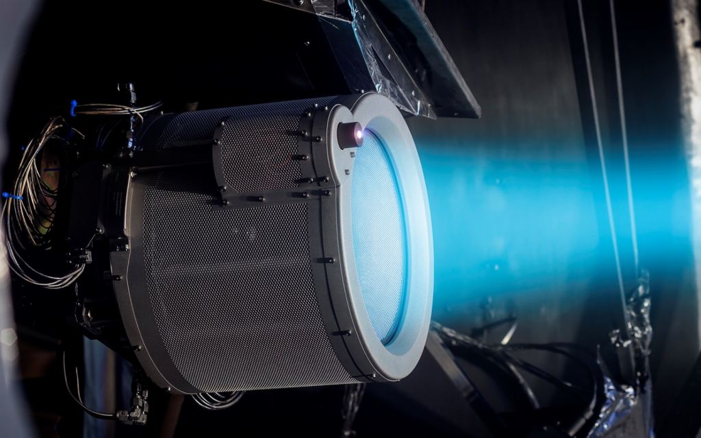 One of the QinetiQ T6 ion engines being tested by the manufacturer. The T6 is a ground-breaking engine developed especially for the BepiColombo mission. Image Credit: QinetiQ