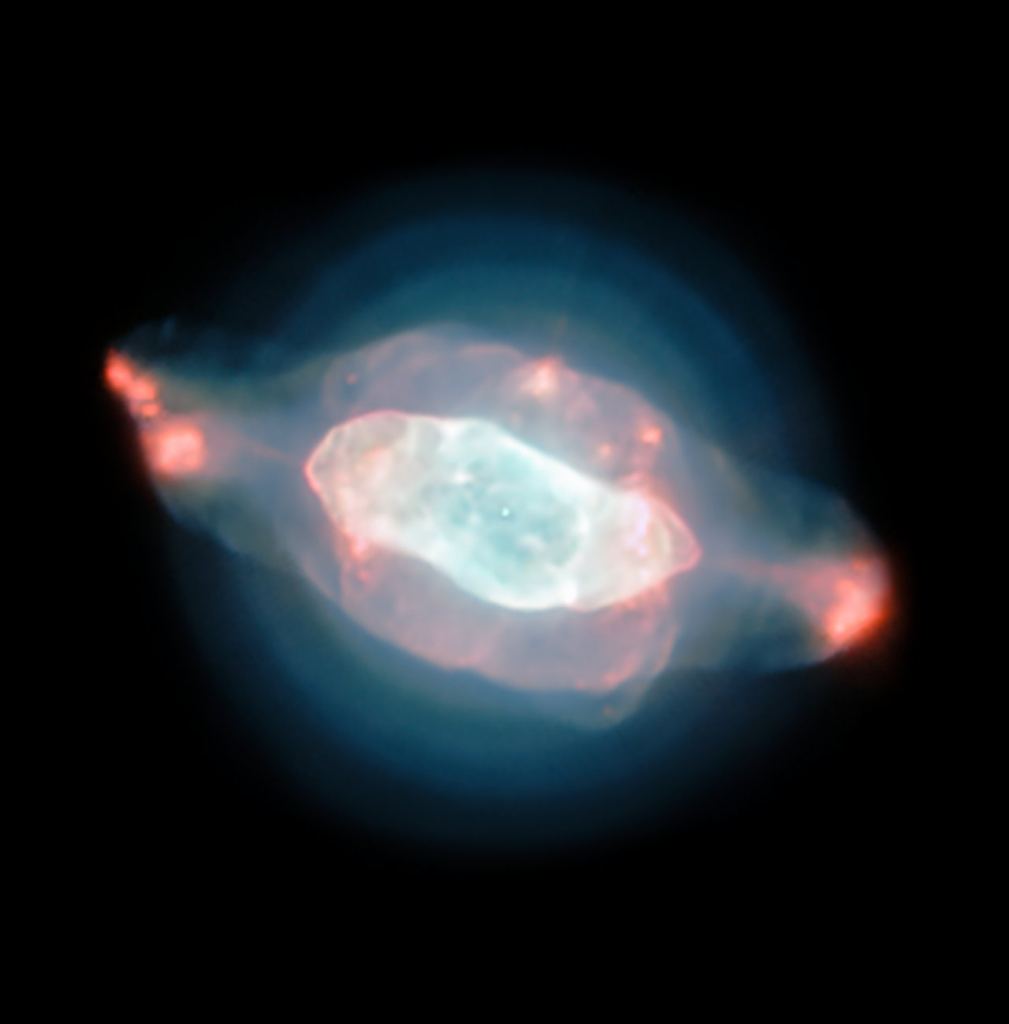 The spectacular planetary nebula NGC 7009, or the Saturn Nebula, emerges from the darkness like a series of oddly-shaped bubbles, lit up in glorious pinks and blues. This colourful image was captured by the powerful MUSE instrument on ESO’s Very Large Telescope (VLT), as part of a study which mapped the dust inside a planetary nebula for the first time. Image Credit: ESO/J. Walsh