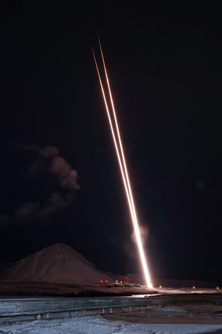 A pair of sounding rockets took aim at the aurora over Svalbard, Norway, to help scientists understand how Earth's atmosphere loses oxygen into space. Even though it's Earth's day side in the image, the launch location is so far north there's no daylight. Image Credit: Allison Stancil-Ervin of NASA’s Wallops Flight Facility.