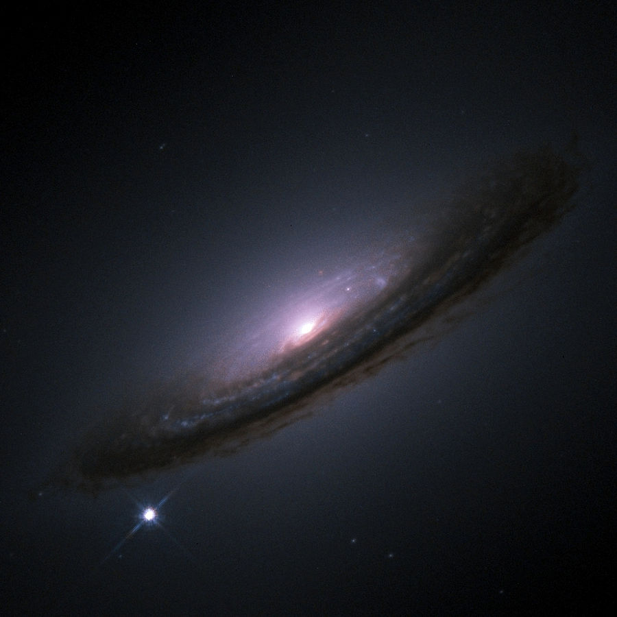 Supernovae are so bright that they outshine their host galaxy. This is SN1994D, on the lower left, outshining its host galaxy NGC 4526. Image Credit: By NASA/ESA, CC BY 3.0, https://commons.wikimedia.org/w/index.php?curid=407520
