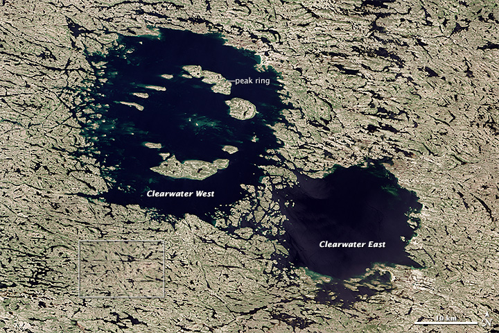 The Clearwater Lakes craters in Quebec, Canada. They were thought to be caused by a pair of binary asteroids, but testing revealed a large disparity in their ages. Image Credit: By NASA Earth Observatory images by Jesse Allen and Robert Simmon, using Landsat 8 data.