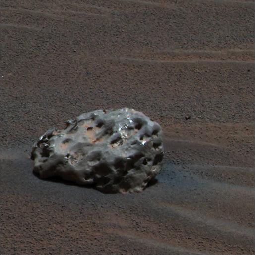 An image of "Heat Shield Rock," the meteorite discovered by Opportunity. Image Credit: By NASA/JPL/Cornell - http://photojournal.jpl.nasa.gov/catalog/PIA07269 (TIFF converted into 100% quality JPEG), Public Domain, https://commons.wikimedia.org/w/index.php?curid=1227482