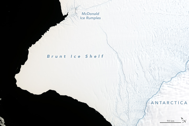 A satellite image of the Brunt Ice Shelf in 2019. Notice the large crack running vertically up the image. Image Credit: NASA.