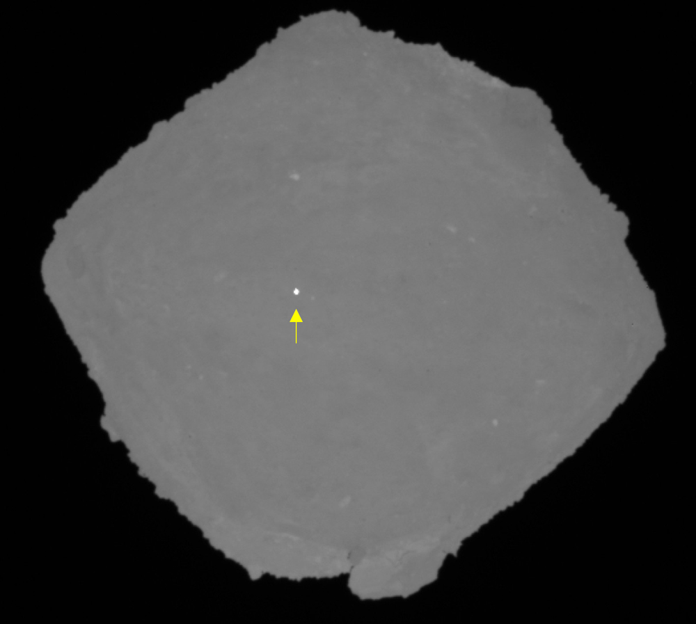 An image of Ryugu captured by the Optical Navigation Camera - Telescopic. The white dot is the target marker that marks the landing site for Hayabusa2's first sample collection. Image Credit: JAXA, University of Tokyo, Kochi University, Rikkyo University, Nagoya University, Chiba Institute of Technology, Meiji University, University of Aizu, AIST.