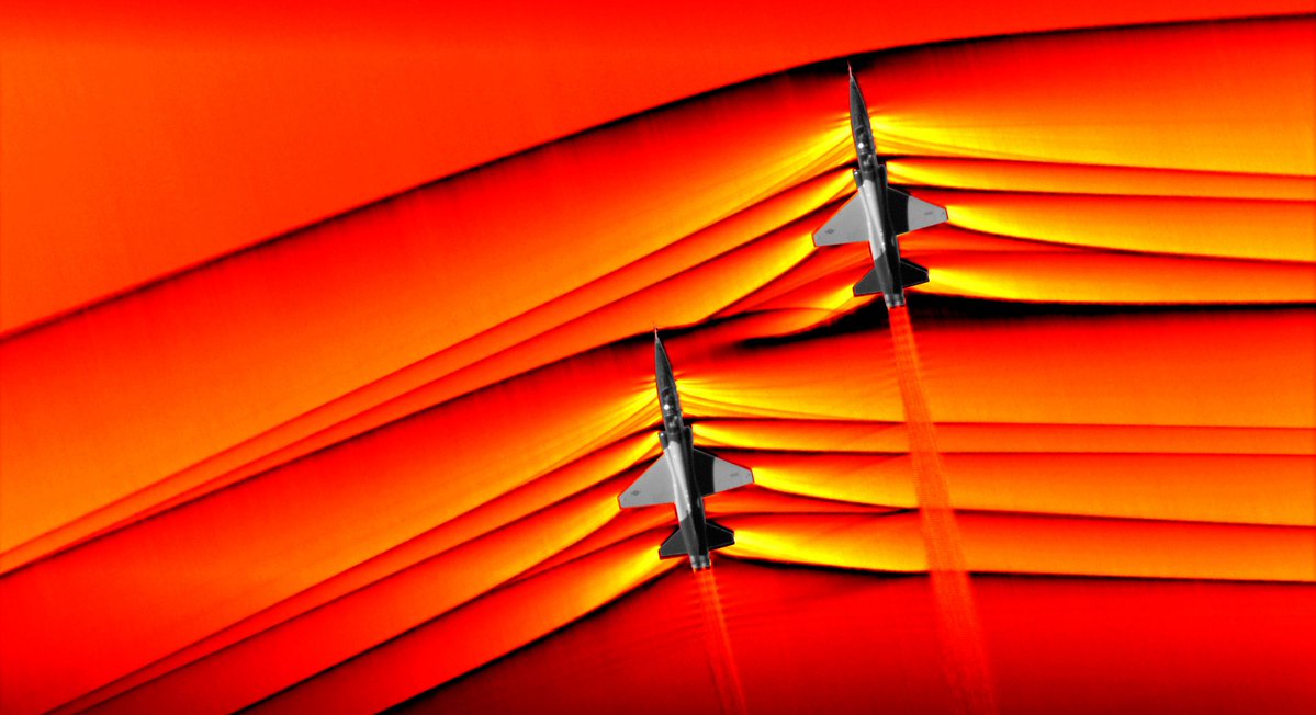 Schlieren photography images of two supersonic jets and their soundwaves. Image Credit: NASA