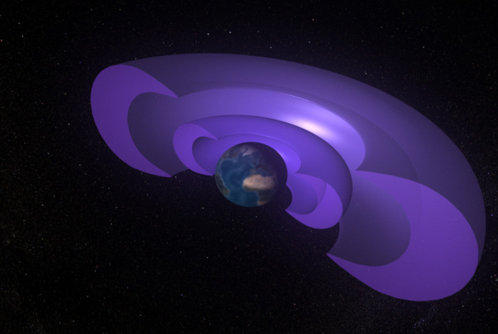 An artist’s rendering of the Van Allen radiation belts surrounding Earth. The purple, concentric shells represent the inner and outer belts. They completely encircle Earth, but have been cut away in this image to show detail. Image Credit: NASA’s Conceptual Image Lab/Walt Feimer
