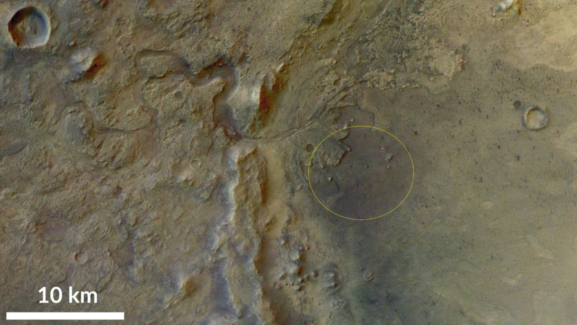 The landing area for NASA's Perseverance Rover is circled in yellow in this image of Jezero Crater. The dry river bed is clearly running into the crater from the left, and the landing circle borders includes part of the delta sediment area. Image Credit: NASA/JPL/University of Arizona.