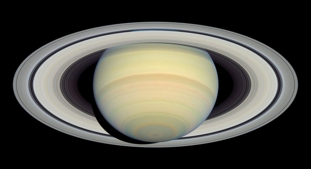  2004 Hubble image of Saturn and its rings. The wide dark gap between the two rings is the Cassini Division. The outer large ring is the A ring and the inner large ring is the B ring. Image Credit: By NASA, ESA and E. Karkoschka (University of Arizona) - http://hubblesite.org/newscenter/archive/releases/2004/18/image/a/ (direct link), Public Domain, https://commons.wikimedia.org/w/index.php?curid=3111498