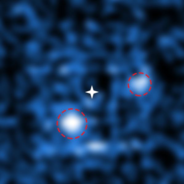 PDS 70 is only the second multi-planet system to be directly imaged. Through a combination of adaptive optics and data processing, astronomers were able to cancel out the light from the central star (marked by a white star) to reveal two orbiting exoplanets. PDS 70 b (lower left) weighs 4 to 17 times as much as Jupiter while PDS 70 c (upper right) weighs 1 to 10 times as much as Jupiter. Image Credit: ESO and S. Haffert (Leiden Observatory)