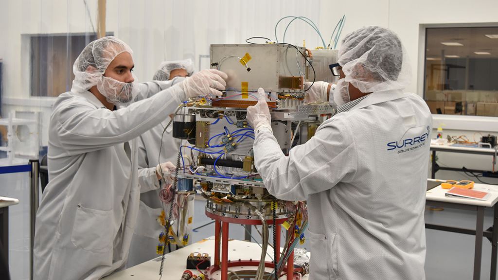 Technicians integrate NASA's Deep Space Atomic Clock into the Orbital Test Bed Earth-orbiting satellite, which will launch on a SpaceX Falcon Heavy rocket, in late June.
 Credits: General Atomics