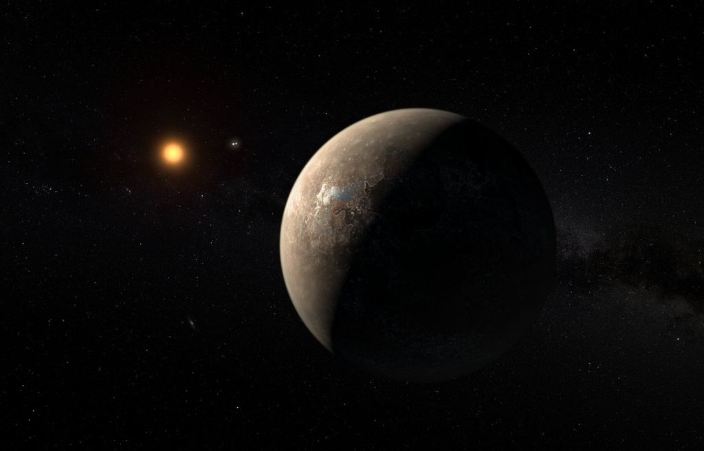 L'impressione di questo artista mostra il pianeta Proxima b in orbita attorno alla stella nana rossa Proxima Centauri, la stella più vicina al Sistema Solare. Credito: ESO/M. Kornmesser