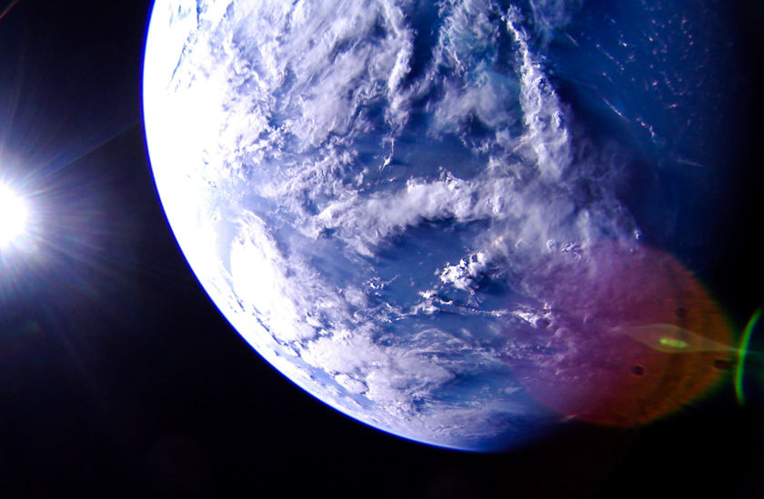 LightSail 2 captured this image of Earth on July 7th. It's looking at the Caribbean Sea towards Central America, with north roughly at the top. The blue-green color of the ocean around the Bahamas can be seen at the picture's 1:00 position. A lens flare is visible in the lower right. Image Credit: The Planetary Society