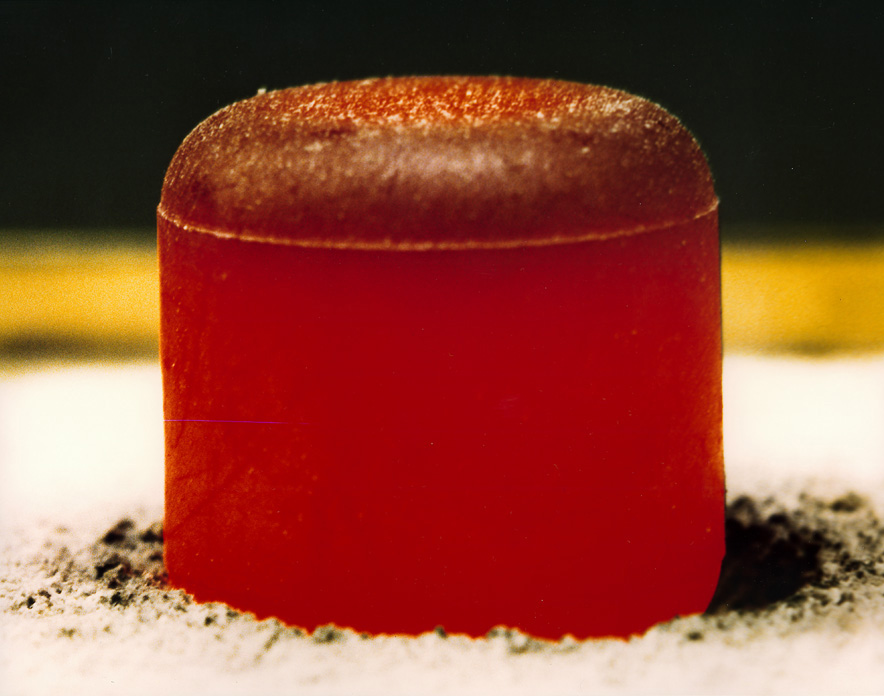A pellet of plutonium 238, the isotope used to power the RTGs on both Voyager spacecraft. As they decay, the pellets release heat, which is why it's glowing red. Image Credit: Los Alamos National Laboratory. 