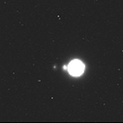 A raw image from JUICE's NavCam. In this image, taken at a distance of over 600 million km (373 million miles) the moons are only a few pixels. Image Credit: Airbus Defence and Space.