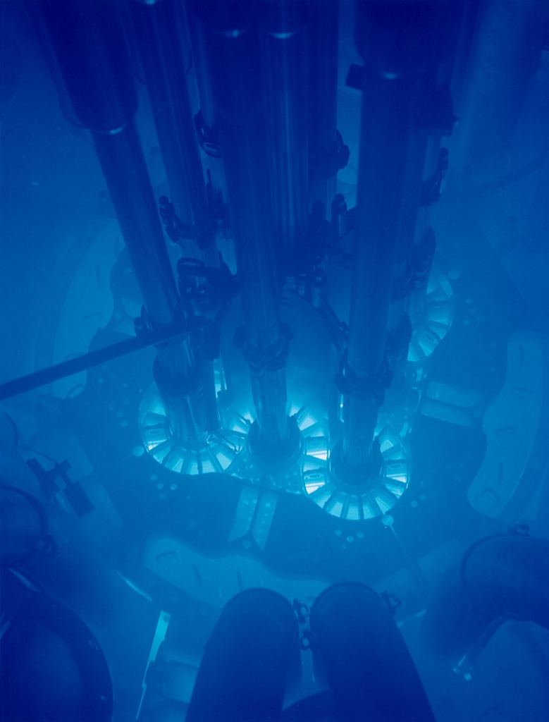 The tell-tale blue glow of Cherenkov radiation from the Advanced Test Reactor in Idaho. Image Credit: By Argonne National Laboratory - originally posted to Flickr as Advanced Test Reactor core, Idaho National LaboratoryUploaded using F2ComButton, CC BY-SA 2.0, https://commons.wikimedia.org/w/index.php?curid=27024528