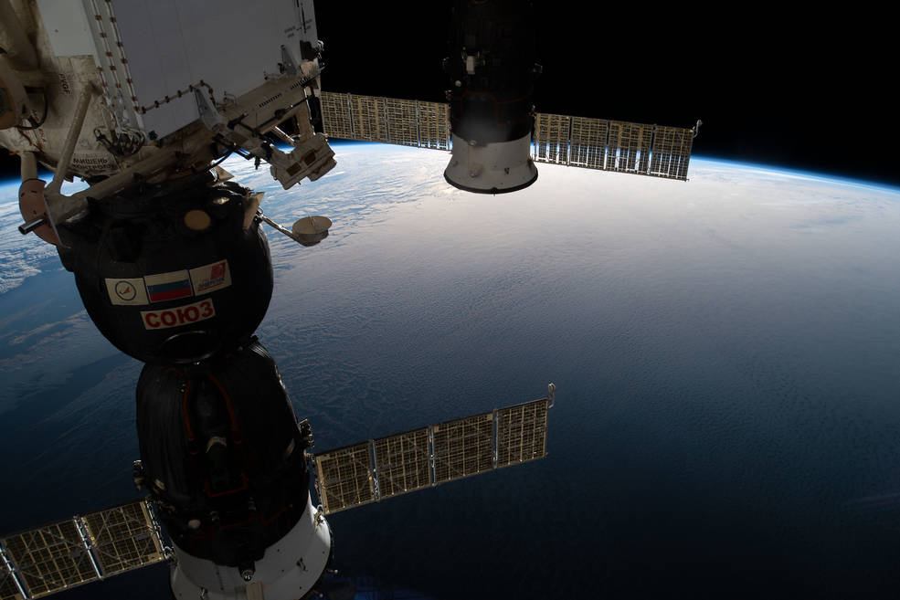 The Soyuz MS-12 crew craft and the Progress 72 space freighter docked with the ISS as it approaches South America. The ISS is 423 km (263 miles) above Earth. Image Credit: NASA