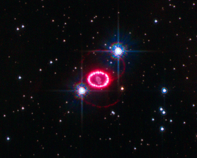 A 2010 Hubble image of SN 1987A showing the expanding shock-wave of material, slamming into surrounding material and heating it up, causing it to shine. Image Credit: By NASA Goddard Space Flight Center from Greenbelt, MD, USA