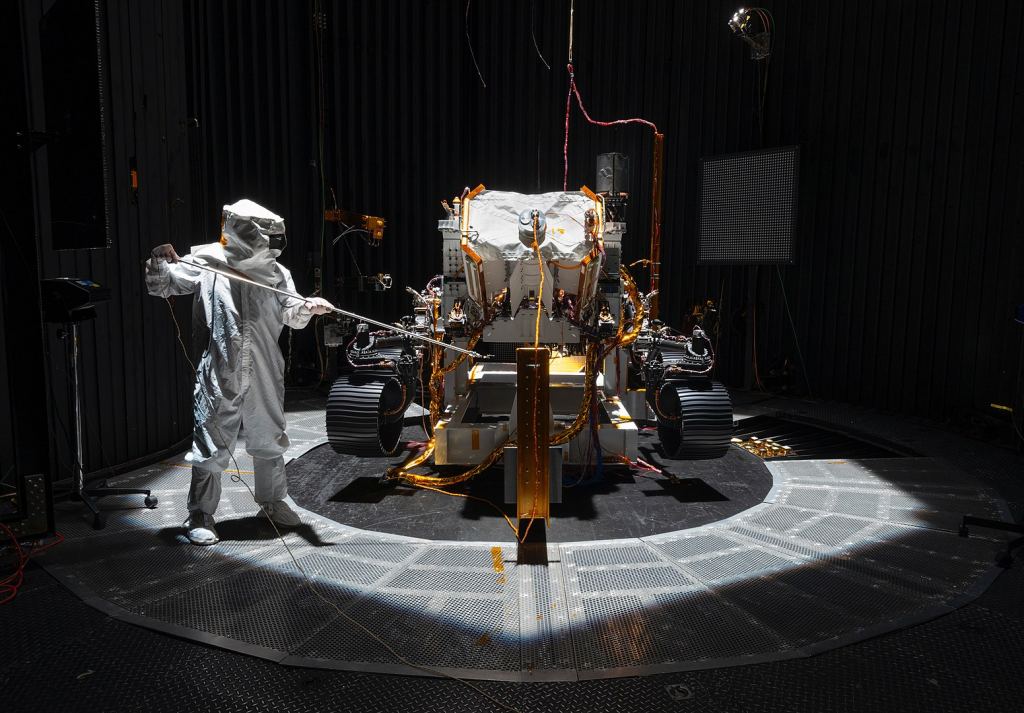 Getting a rover to Mars is a long, complicated undertaking, involving a lot of testing. Here's the 2020 rover getting probed in a clean room. The probe measures how much light reaches each part of the rover. Image Credit: By NASA/JPL-Caltech