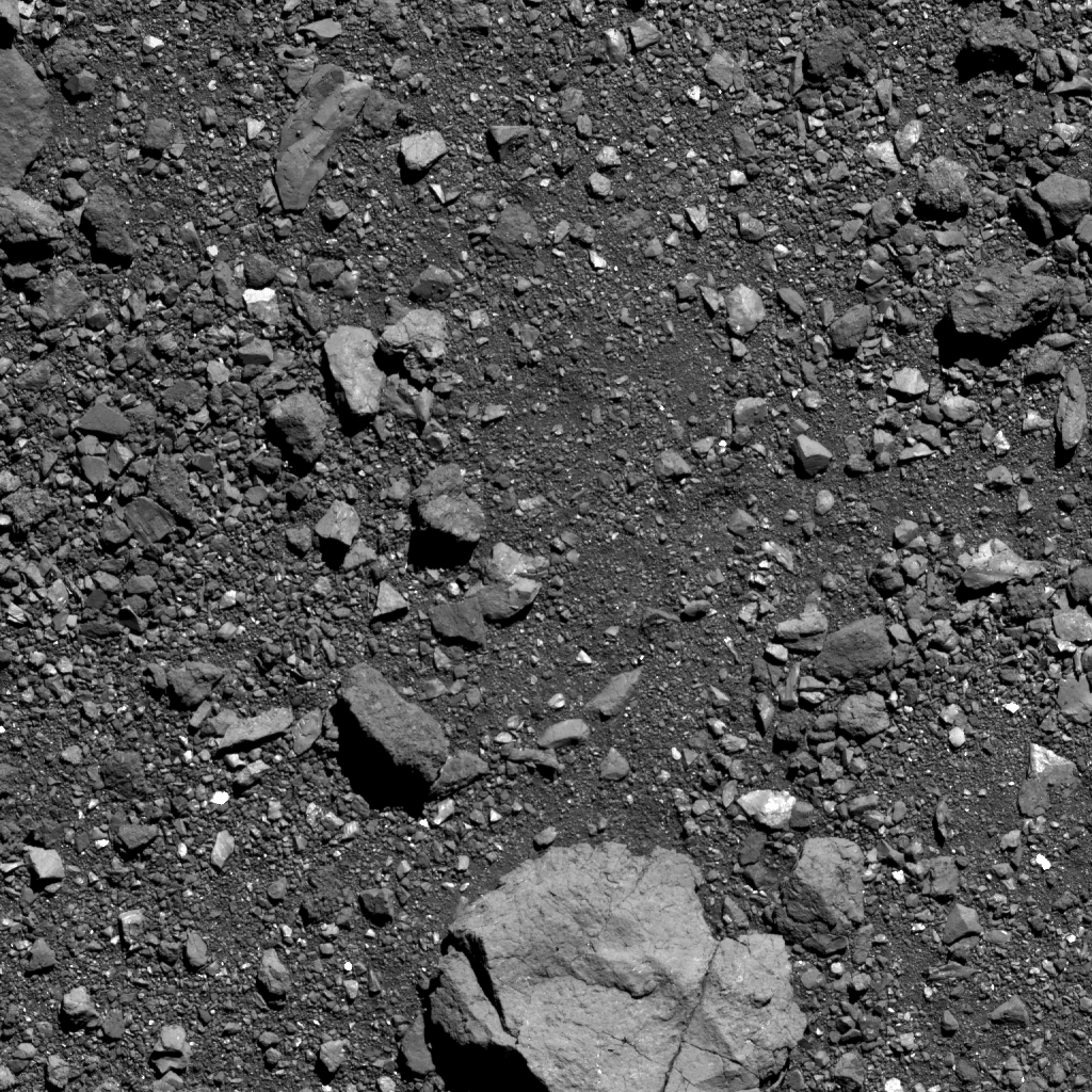 This is the highest-resolution image of candidate sample site Sandpiper that’s been captured as of October 5. Site Sandpiper is located in asteroid Bennu’s southern hemisphere, and the region of interest is visible in the center of the image (situated above the large boulder). The image was taken by the PolyCam camera on NASA’s OSIRIS-REx spacecraft on October 5, from a distance of 0.6 miles (1 km). The field of view is 48 ft (14.6 m). For scale, the large, light colored boulder in the bottom center of the image is 16 ft (5 m) wide, which is about the size of a box truck. For scale, the large, light colored boulder in the bottom center of the image is 16 ft (5 m) wide, which is about the size of a box truck. Image Credit:  NASA/Goddard/University of Arizona 