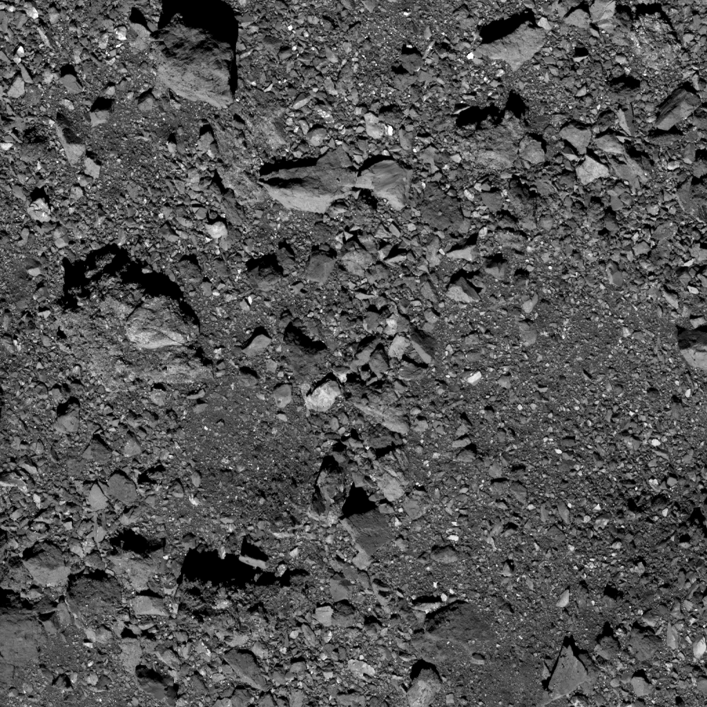  This is the highest-resolution image captured of candidate sample site Kingfisher as of October 19. Site Kingfisher is located near asteroid Bennu’s equator in the northern hemisphere. The site itself is visible in the lower right of the image, located in the middle of the relatively clear space. The image was taken by the PolyCam camera on NASA’s OSIRIS-REx spacecraft on October 19, from a distance of 0.6 miles (1 km). The field of view is 47 ft (14.4 m). For reference, the small crater is 9 ft (2.7 m) across, which is about the length of a dolphin. Image Credit:  NASA/Goddard/University of Arizona