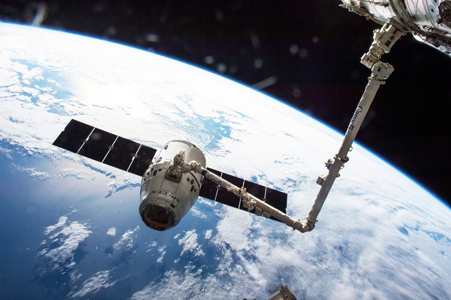 The Canadarm 2 catching a SpaceX Dragon cargo ship and docking it with the ISS. Image Credit: NASA