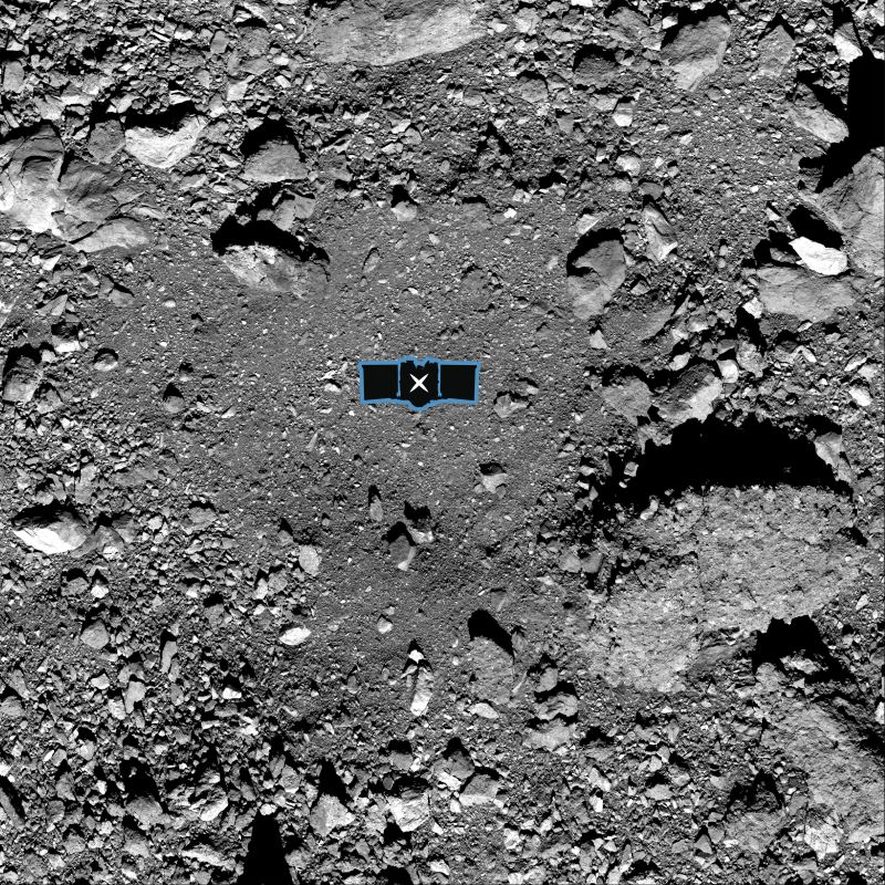  This image shows sample site Nightingale, OSIRIS-REx’s primary sample collection site on asteroid Bennu. The image is overlaid with a graphic of the OSIRIS-REx spacecraft to illustrate the scale of the site. Credits: NASA/Goddard/University of Arizona 