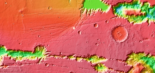 In this image the crater is marked by a small white rectangle near the center of the image. Valles Mariners is to the south. Image Credit: NASA/MOLA/USGS