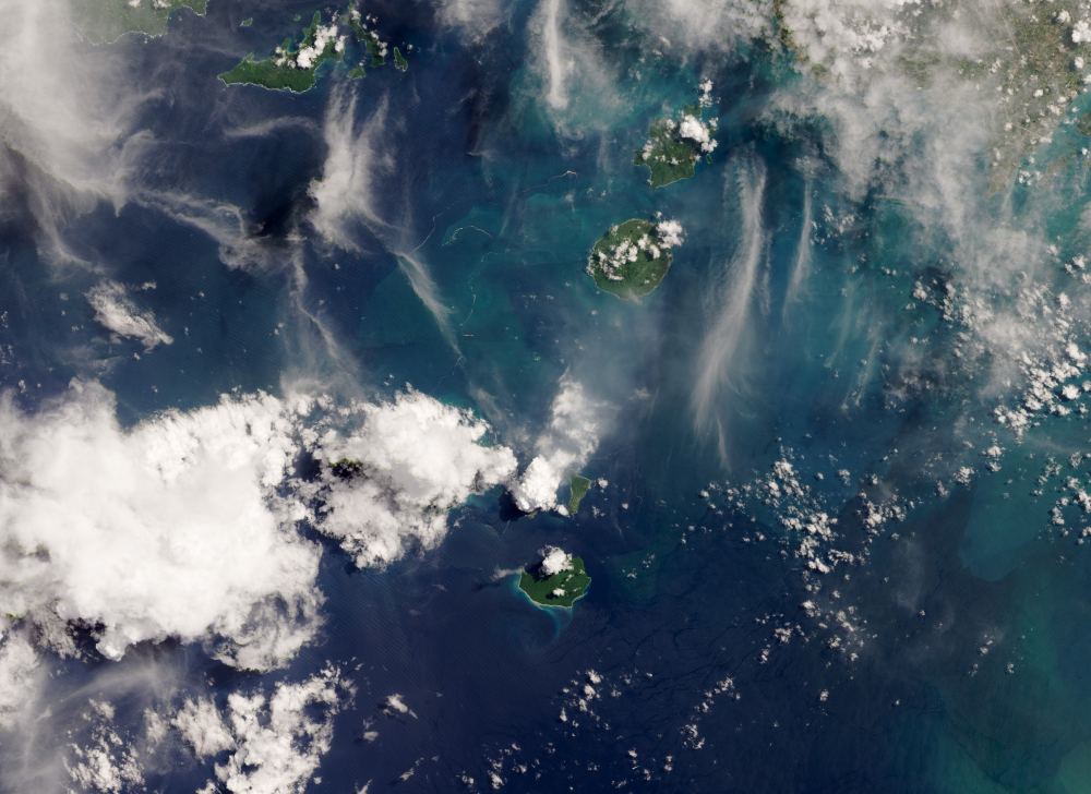 A larger image of the Sunda Strait region, with Anak Krakatau and its plumes in the center. Image Credit:  NASA Earth Observatory image by Lauren Dauphin, using Landsat data from the U.S. Geological Survey. 