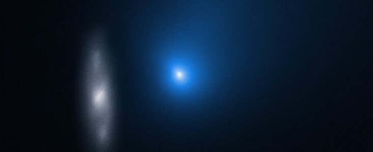 Hubble captured this image of Comet 2I/Borisov in late 2019, as it sped past the Sun at over 175,000 km/h (109,000 mp/h.) That speed makes it one of the fasted comets ever observed. The hazy object on the left is a distant spiral galaxy in the background. Image Credit: NASA, ESA, and D. Jewitt (UCLA) 