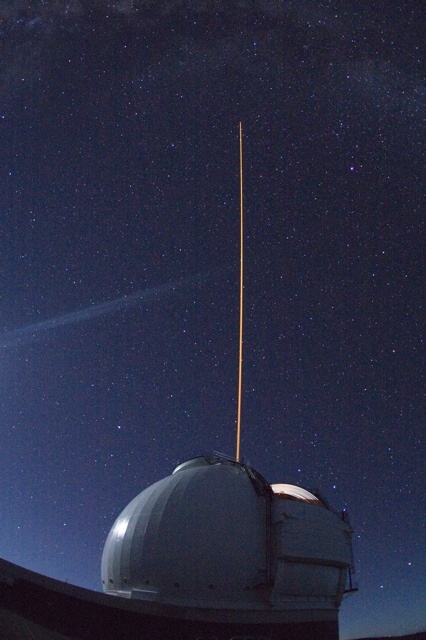 The Keck II with its laser guide star. The guide star is used to calibrate the telescope's adaptive optics system. Image Credit: Keck Observatory/Dick Lundholm