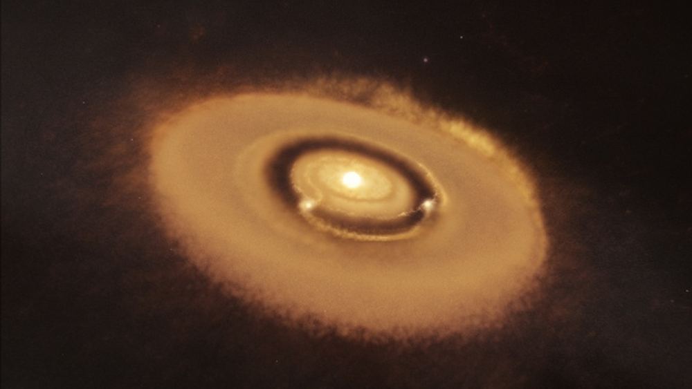 An artist's illustration of young planets forming out of the disk around a young star. The two planets are clearing a gap in the circumstellar disk as they form. The massive hot stars in Westerlund 2 are so hot they're destroying the disks in their neighbourhood, preventing planets from forming. Image Credit: W. M. Keck Observatory/Adam Makarenko