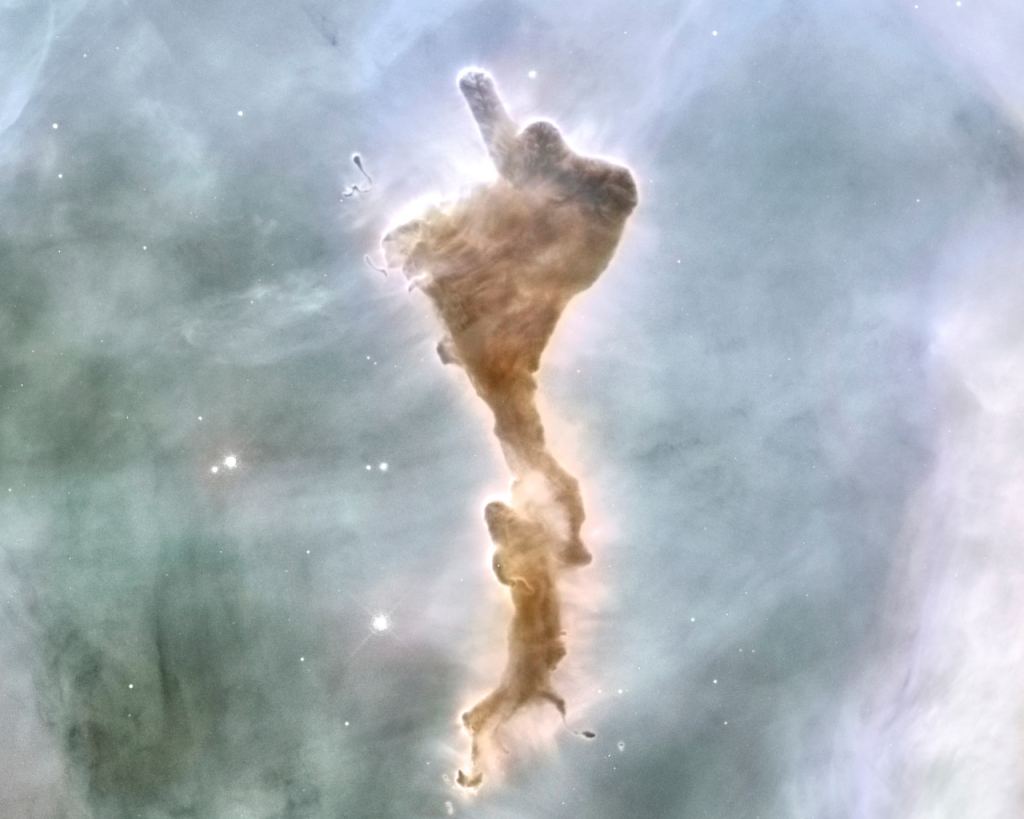 This molecular cloud is nick-named The Defiant Finger, for obvious reasons. It's in the Carina Nebula, and if this new study is correct, icebergs of molecular hydrogen ice form inside it. Image Credit: By NASA, ESA, N. Smith (University of California, Berkeley), and The Hubble Heritage Team (STScI/AURA); credit for CTIO Image: N. Smith (University of California, Berkeley) and NOAO/AURA/NSF - http://hubblesite.org/newscenter/archive/releases/2007/16/image/a/, Public Domain, https://commons.wikimedia.org/w/index.php?curid=53662647