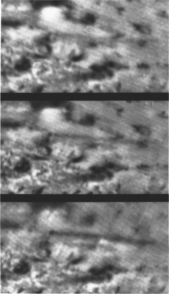 Three grainy images of Triton's surface from Voyager 2. This is a time sequence of image taken 45 minutes apart, from top to bottom. They show a dark geyser-like plume of material reaching a height of 8 km (5 mi) above the surface. The cloud of material drifts downward to the right for about 150 km (100 miles) and appears to get denser in each image. Image Credit: NASA/JPL 