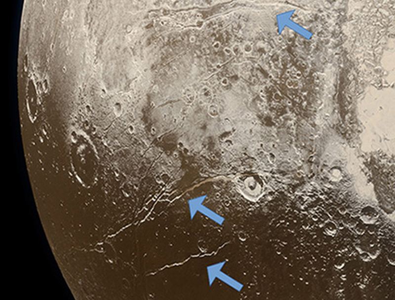 Extensional faults (arrows) on the surface of Pluto indicate expansion of the dwarf planet’s icy crust, attributed to freezing of a subsurface ocean. (Image credit: NASA/Johns Hopkins University Applied Physics Laboratory/Southwest Research Institute/Alex Parker)