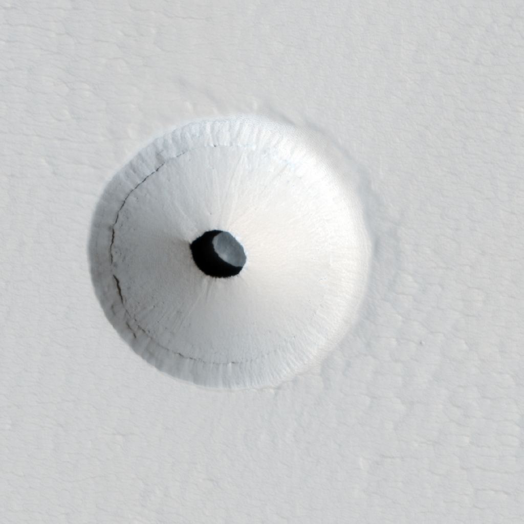 This is a cropped version of a HiRISE image of a lava tube skylight on the martian volcano Pavonis Mons. Image Credit: By NASA / Jet Propulsion Laboratory / University of Arizona - http://hirise.lpl.arizona.edu/ESP_023531_1840, Public Domain, https://commons.wikimedia.org/w/index.php?curid=20314169