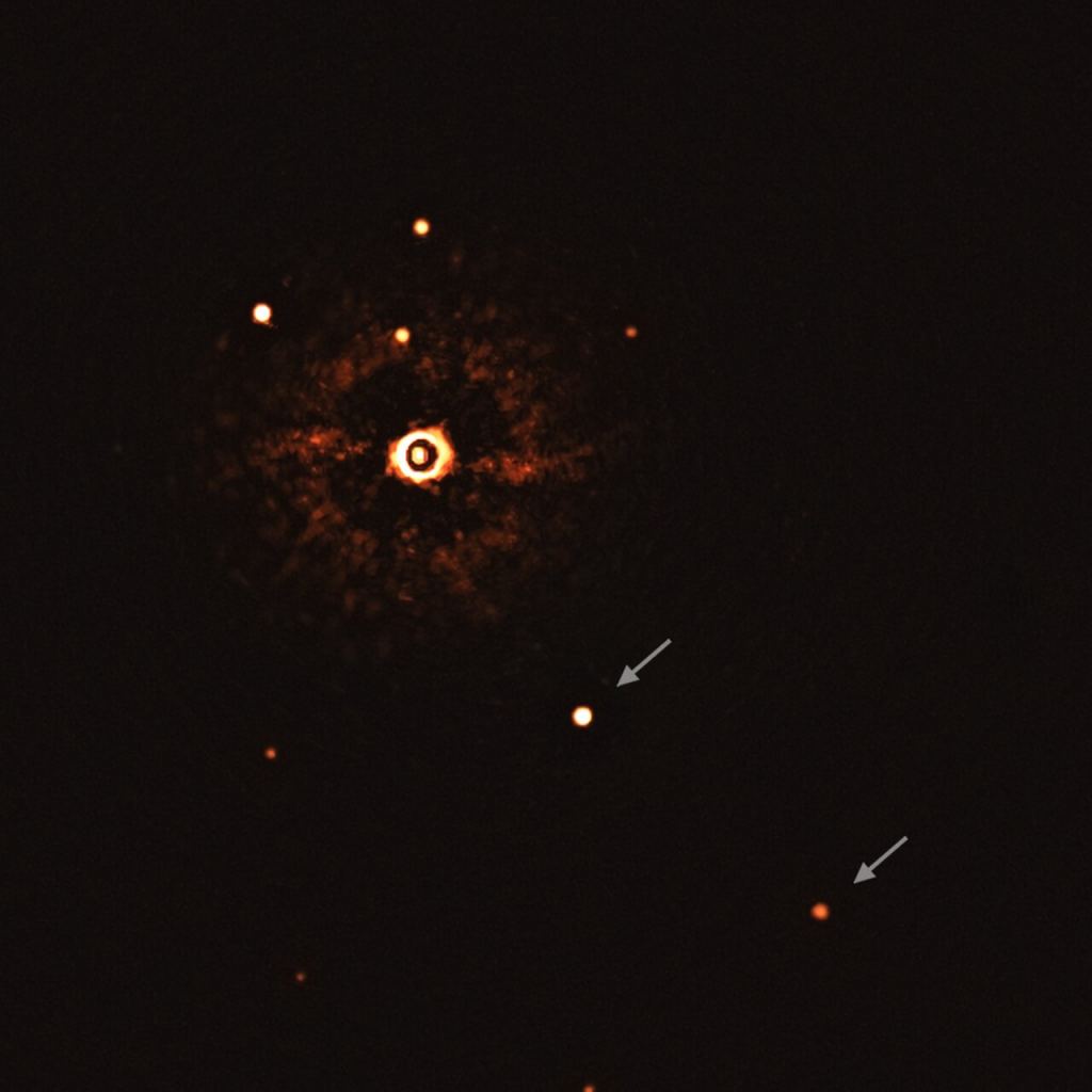 This image, captured by the SPHERE instrument on ESO’s Very Large Telescope, shows the star TYC 8998-760-1 accompanied by two giant exoplanets, TYC 8998-760-1b and TYC 8998-760-1c. This is the first time astronomers have directly observed more than one planet orbiting a star similar to the Sun.