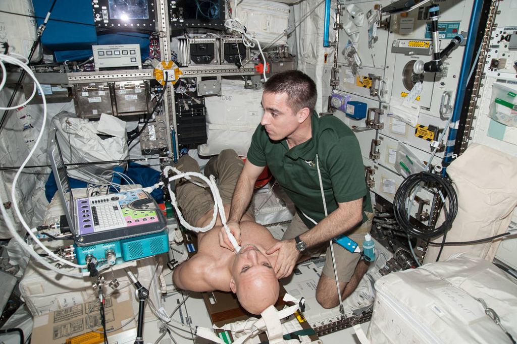 In the International Space Station’s Columbus laboratory, NASA astronaut Chris Cassidy performs an ultrasound on ESA astronaut Luca Parmitano for the Spinal Ultrasound investigation. The Spinal Ultrasound investigation sought to understand astronaut height increases while advancing medical imaging technology, by testing a smaller and more-portable ultrasound device aboard the station. Image Credit: NASA/ESA