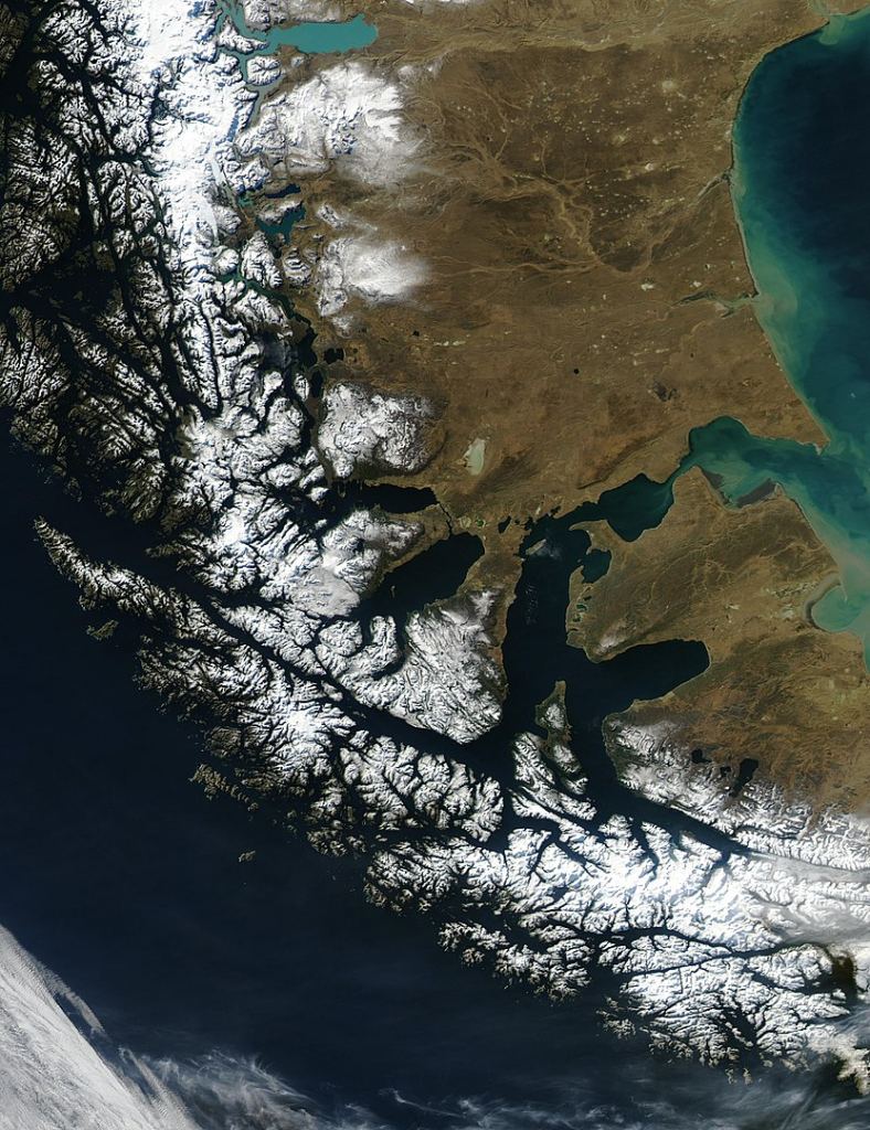 The Strait of Magellan provides safe sea passage between the Atlantic and the Pacific Oceans, the only safe way until the construction of the Panama Canal. It's protected by Tierra del Fuego to the south, and by South America to the north. Image Credit: By Jacques Descloitres, MODIS Rapid Response Team, NASA/GSFC - http://visibleearth.nasa.gov/view_rec.php?id=6092Transferred from the English Wikipedia originally here, Public Domain, https://commons.wikimedia.org/w/index.php?curid=35059 