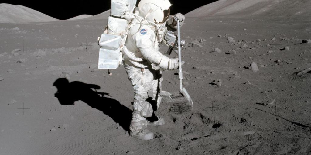 Image of Apollo Astronaut Harrison Schmitt diggin in the lunar dust that he is actually allergic to.