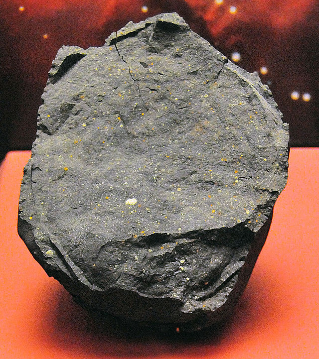 The Murchison meteorite fell to Earth in Australia in 1969. It contained 15 amino acids, including glycine. Image Credit: By User:Basilicofresco - Derivative work from Image:Murchison meteorite.jpg, CC BY-SA 3.0, https://commons.wikimedia.org/w/index.php?curid=4301968