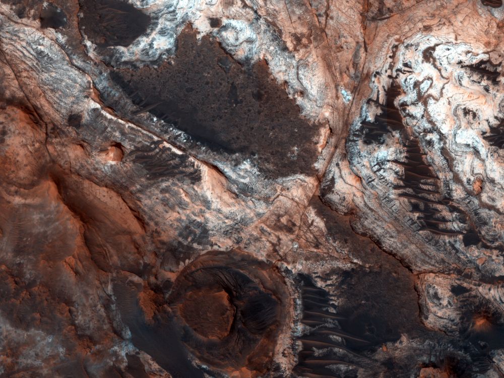This image shows a small portion of Mawrth Vallis, one of the many outflow channels feeding north into the Chryse Basin. This ancient valley once hosted flowing water. The erosive power of the flowing water rapidly cut down into the underlying layers of rock to expose a host of diverse geologic landforms visible today. Image Credit: NASA/JPL/UArizona.