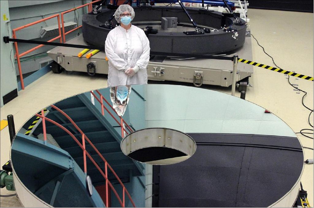 The Roman's primary mirror is made by the L3Harris company. In this image, Bonnie Patterson of L3Harris stands with the completed primary mirror for the Nancy Grace Roman Space Telescope (photo credit: L3Harris)