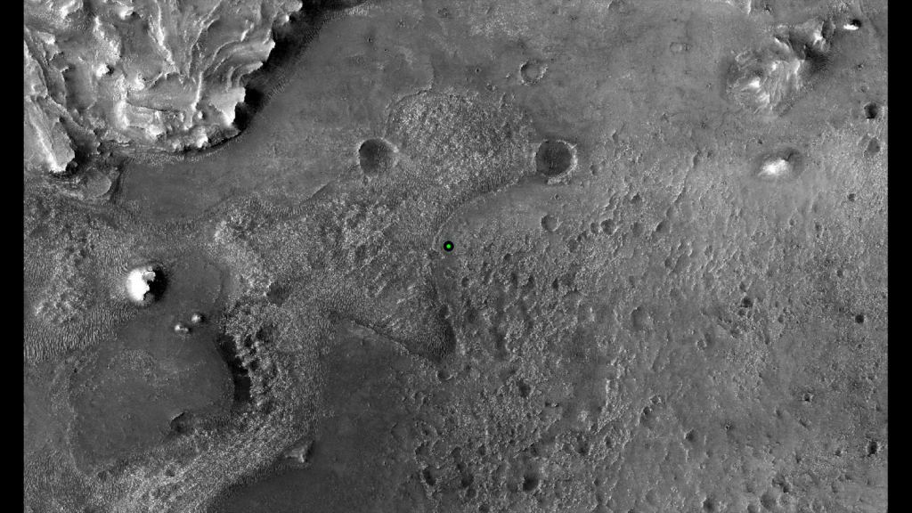 This image shows with a green dot where NASA's Perseverance rover landed in Jezero Crater on Mars on Feb. 18, 2021. The base image was taken by the HiRISE camera aboard NASA's Mars Reconnaissance Orbiter (MRO). Along with the Mars Express Orbiter, the MRO has imaged Jezero in detail. Image Credit: NASA/JPL-Caltech/University of Arizona