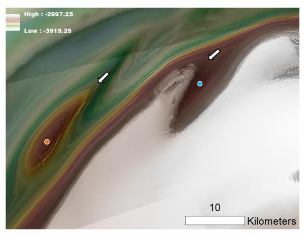 Image of some polar troughs on Mars.  The orange dot indicated a mound, while the blue dot indicates a depression.  The white arrows point to trough walls that connect the features to where erosion might have contributed to their formation.