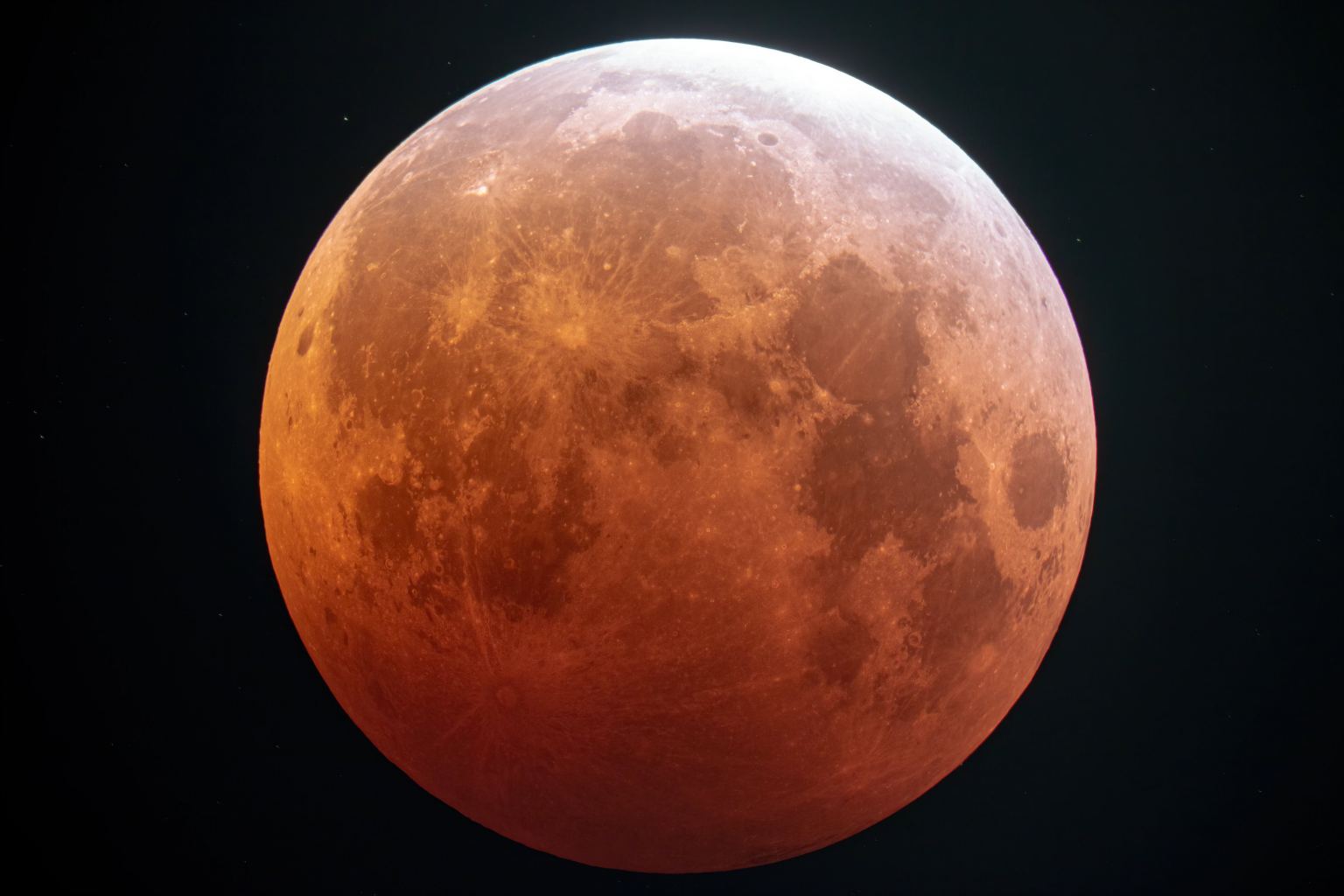 Views of Wednesday Morning's Amazing Total Lunar Eclipse from Around