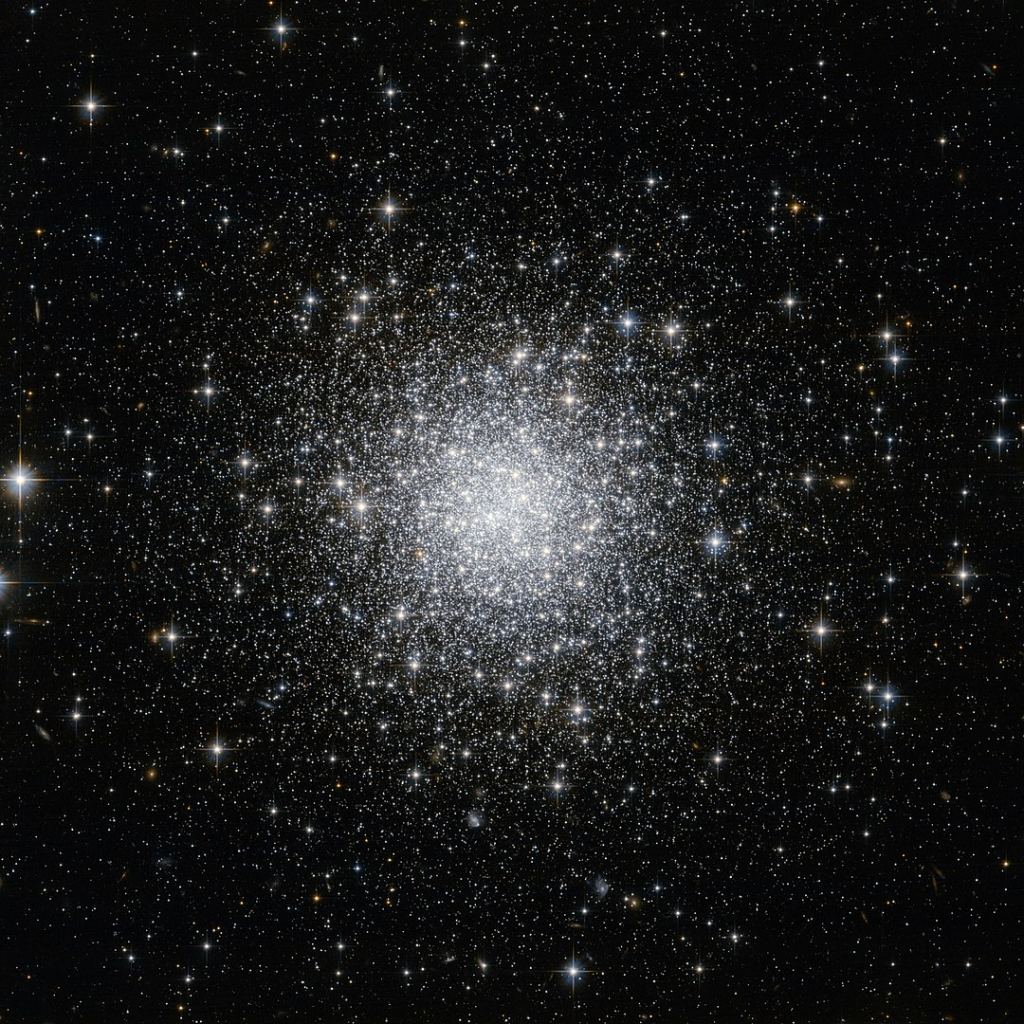 This NASA/ESA Hubble Space Telescope image shows a compact and distant globular star cluster named NGC 7006. It's a Class 1 globular cluster, meaning its stars are highly concentrated rather than spread out and diffuse. Image Credit: By NASA Hubble - https://www.flickr.com/photos/144614754@N02/49200475127/, CC BY 2.0, https://commons.wikimedia.org/w/index.php?curid=87407272