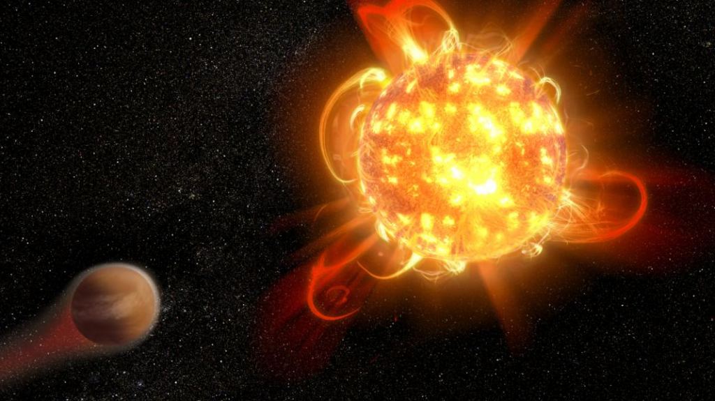 We can't talk about red dwarf exoplanet habitability without bringing up red dwarf flaring. Stellar flares could threaten life on red dwarf planets. Credit: NASA, ESA and D. Player (STScI)