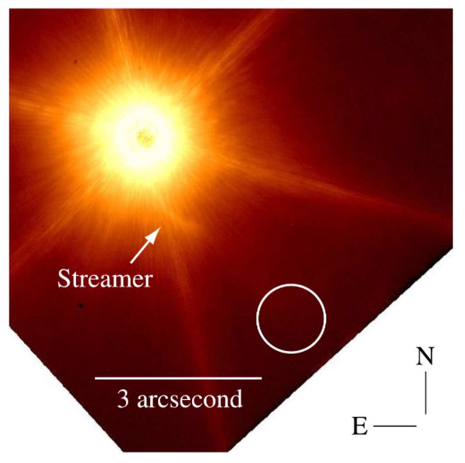 This is a Keck Telescope image of Z CMa from 2005 showing the streamer. The white circle shows the point source C, which is interpreted as the interloper that created the streamer. Image Credit: Keck/ Dong et al 2022.  